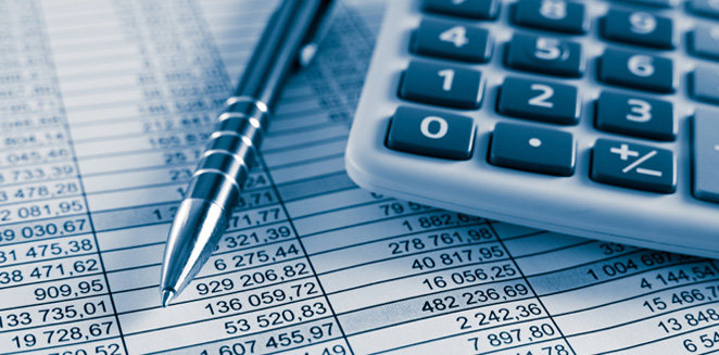 Calculator and a pen on a sheet of paper